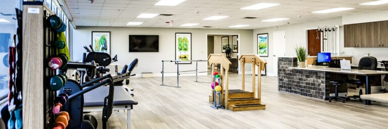 Interior view of a therapy room with exercise equipment