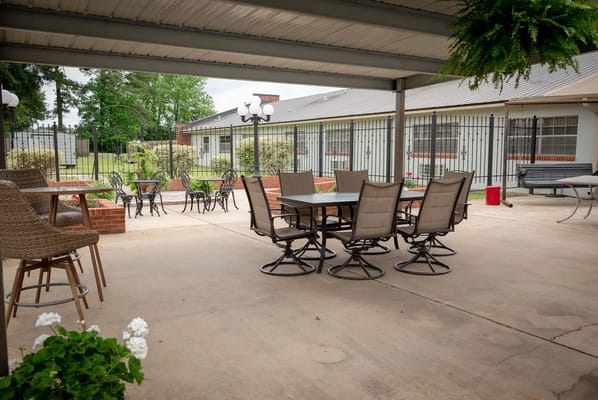 Outdoor seating area with tables and chairs