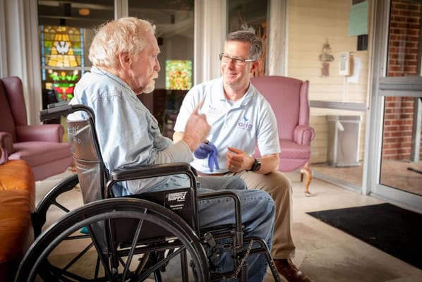 Staff member engaging with a resident in a common area