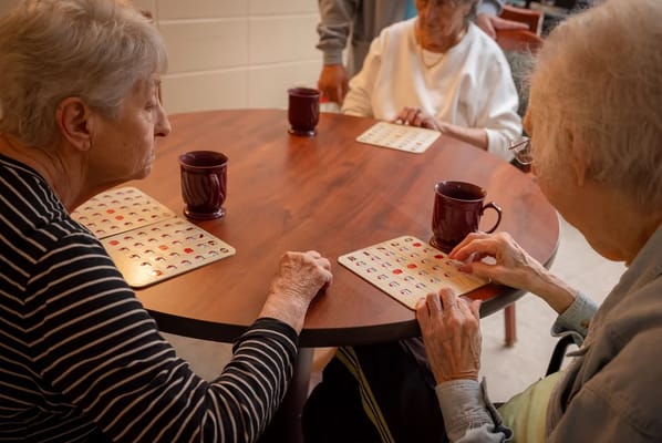 Residents playing bingo at a table