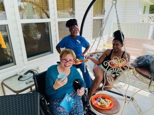 Residents enjoying a meal in an outdoor setting