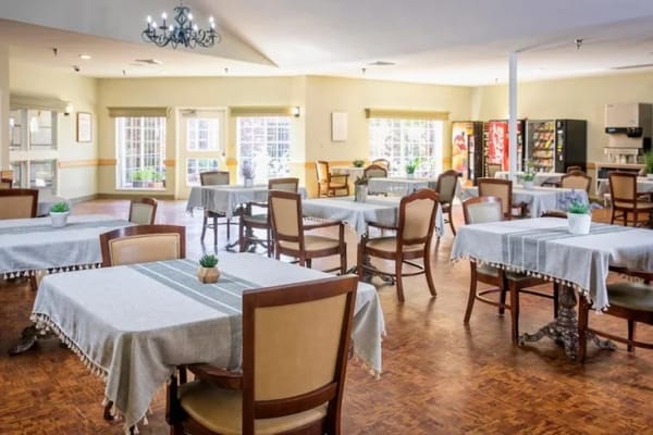 Bright dining room with tables set for meals