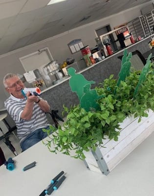 Resident enjoying a playful activity indoors