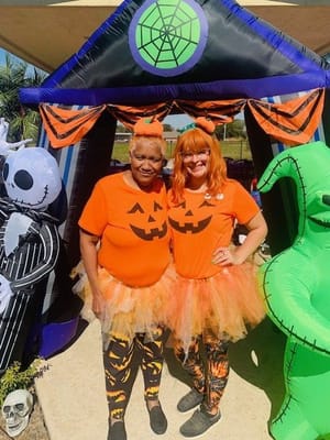 Residents and staff celebrating Halloween in costumes