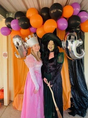 Staff and resident dressed for a Halloween celebration