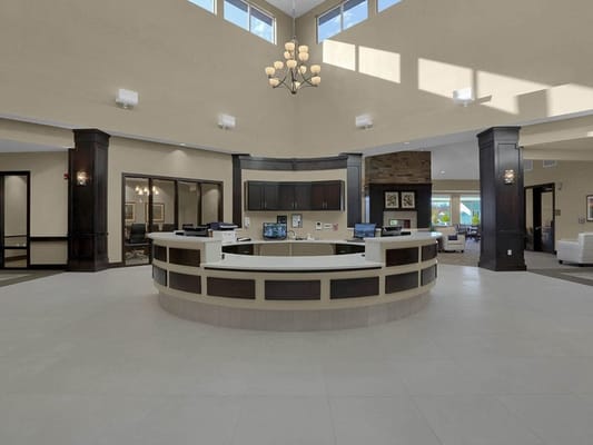 Bright reception area with high ceilings and modern decor
