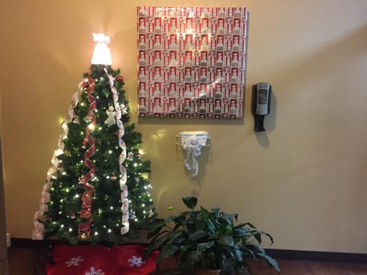 Decorated Christmas tree in a warm lobby