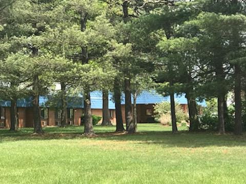 Exterior view of the facility among trees
