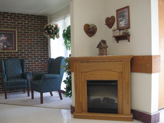 Cozy interior with chairs and a fireplace