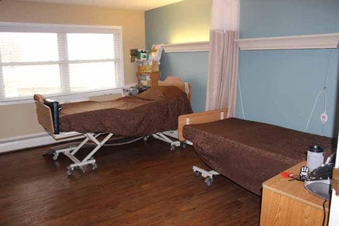 Two resident beds in a cozy room setting