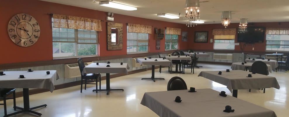 Dining area set up with tables and chairs