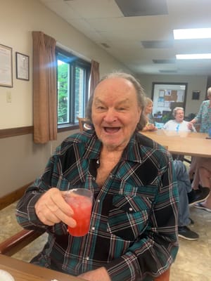 Resident enjoying a drink in a common area