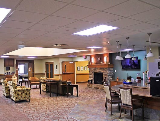 Interior common area with seating and a fireplace