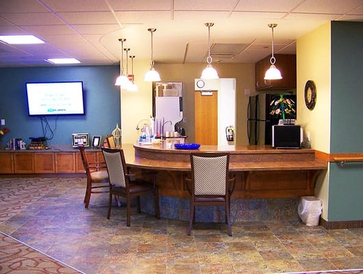 Bright common area with a service bar and seating