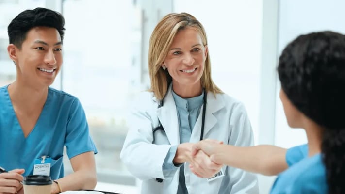 Medical staff interacting with a resident in an office