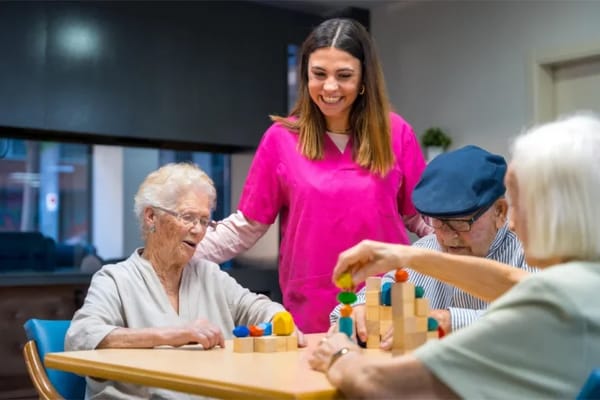 Residents and staff engaging in a playful activity.