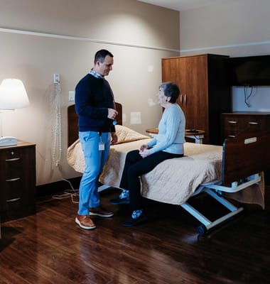 Staff member interacting with a resident in a private room