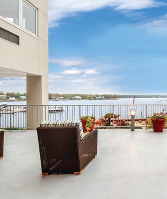 Patio seating overlooking a lakeside view