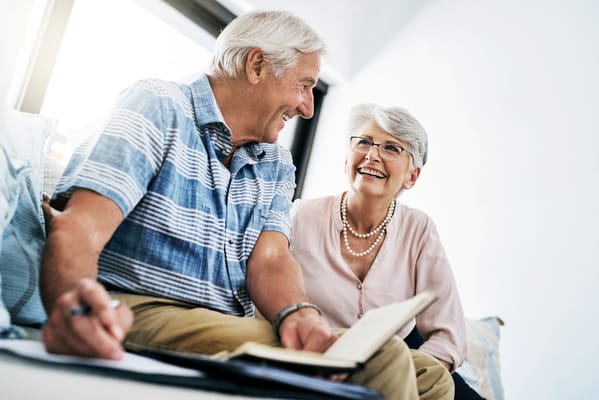 Happy couple engaging in conversation indoors