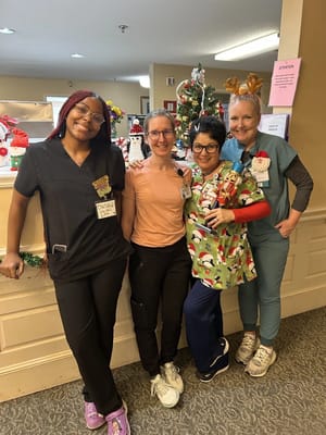 Staff posing together in a festive setting