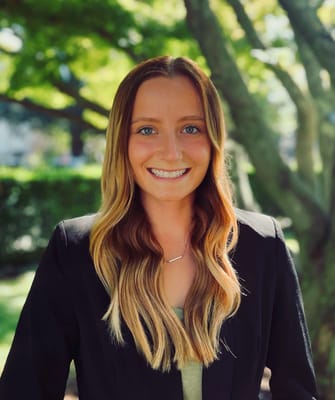 Portrait of a smiling staff member outdoors