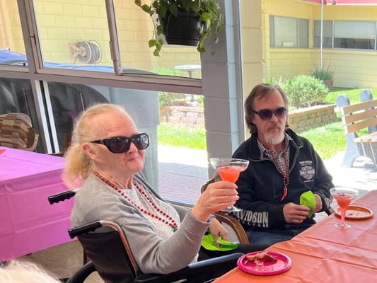 Residents enjoying drinks at a social gathering