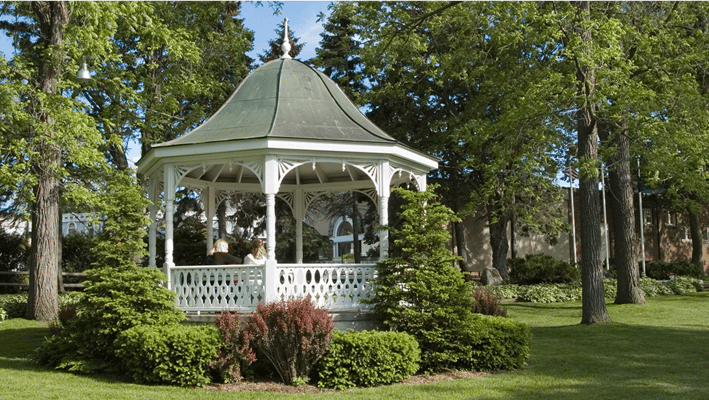 Residents enjoying a gazebo in the garden