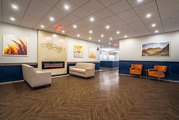Bright common area with seating and decorative art
