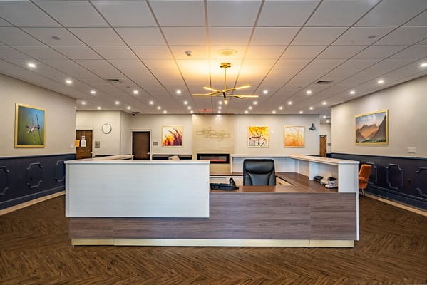 Bright reception area with modern decor and seating