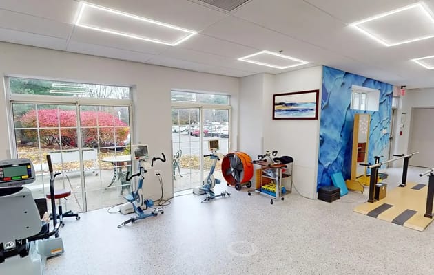 Interior view of a therapy room with exercise equipment