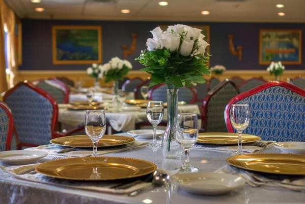 Beautifully arranged dining table with flowers