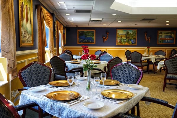 Elegant dining room setup with floral centerpiece