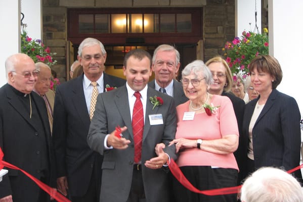 Ribbon-cutting ceremony with residents and staff