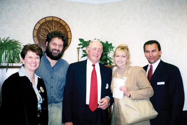 Group of people smiling in a social setting