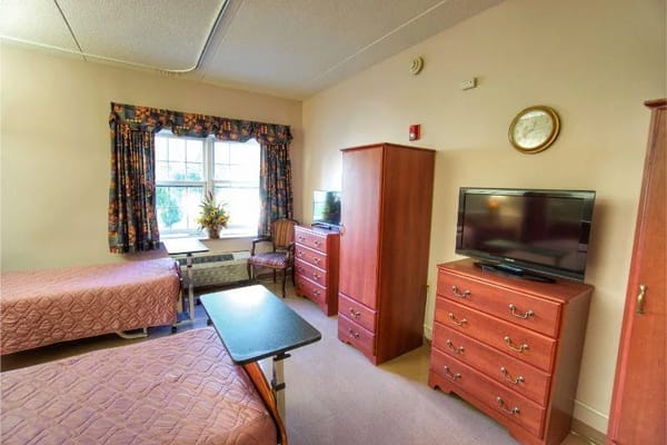 Interior view of a cozy resident room with twin beds