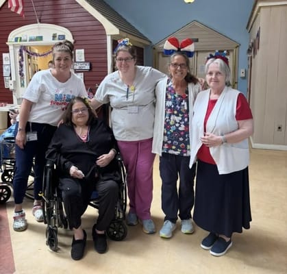 Staff and residents celebrating together in the common area