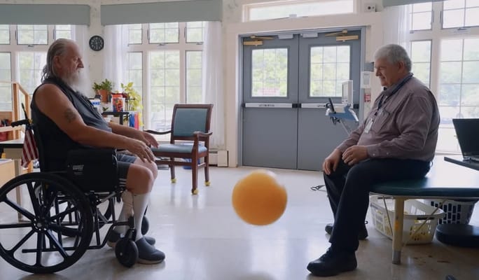 Two residents engaging in a playful activity indoors