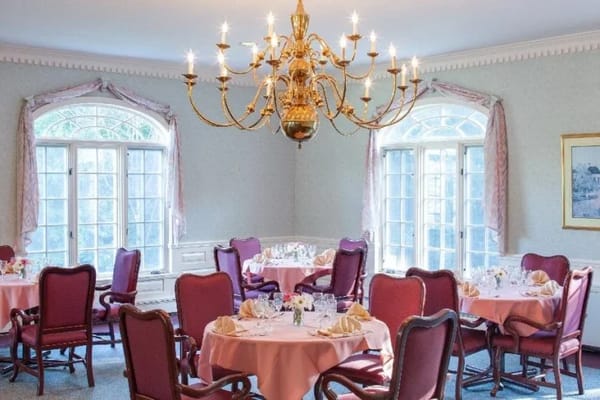 Elegant dining room with tables set for a meal