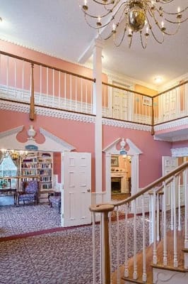 Interior view of a welcoming common area with a staircase