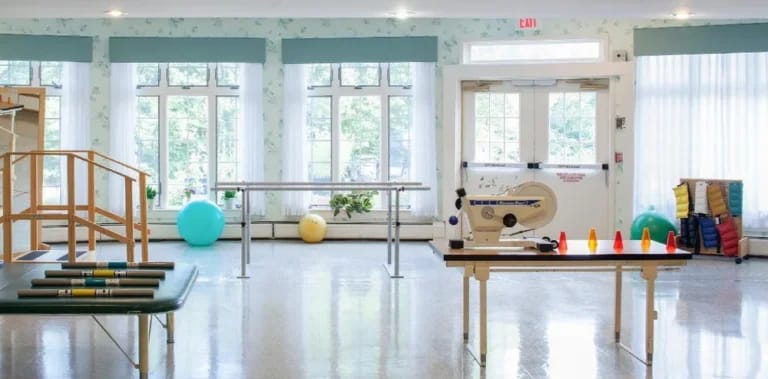 Interior view of a rehabilitation room with therapy equipment