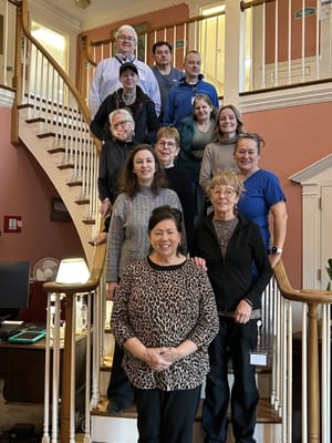 Staff and residents gathered on the staircase