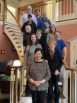 Staff and residents gathered on the staircase