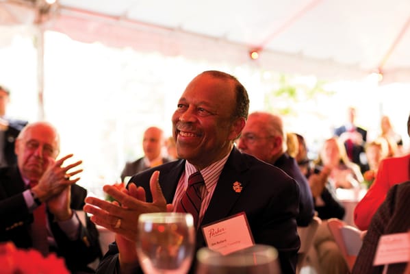 Residents and staff enjoying a celebration outdoors