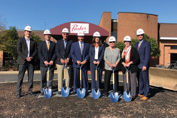Groundbreaking ceremony with staff in hard hats