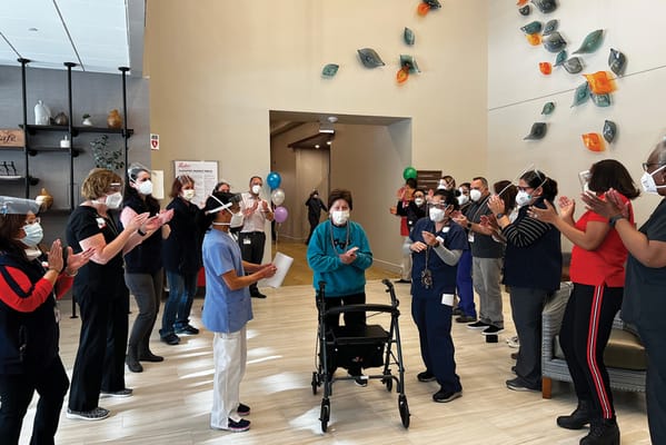 Staff and residents celebrating in a common area