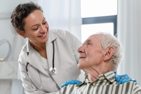 Nurse interacting with an elderly resident in a care setting