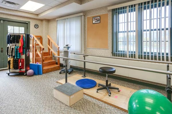 Rehabilitation room with therapy equipment and exercise tools