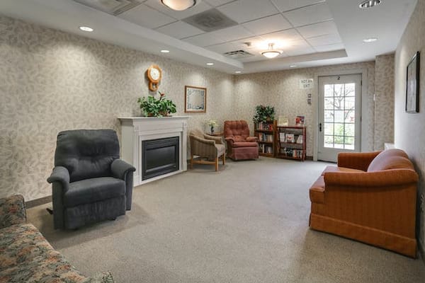 Indoor common area with seating and bookshelves