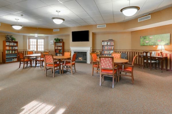 Bright common area with tables and chairs