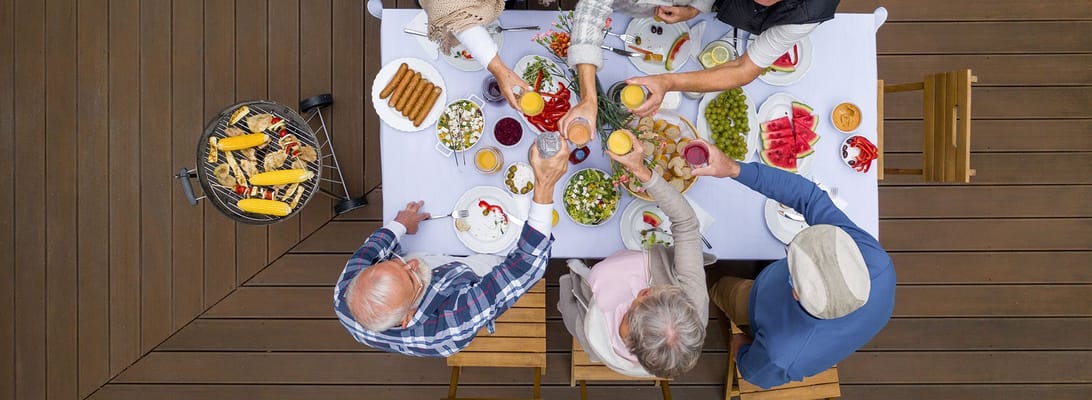 Residents enjoying a meal outdoors together